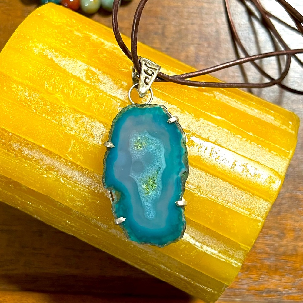Artisan made agate pendant on leather cord necklace with silver tone metal